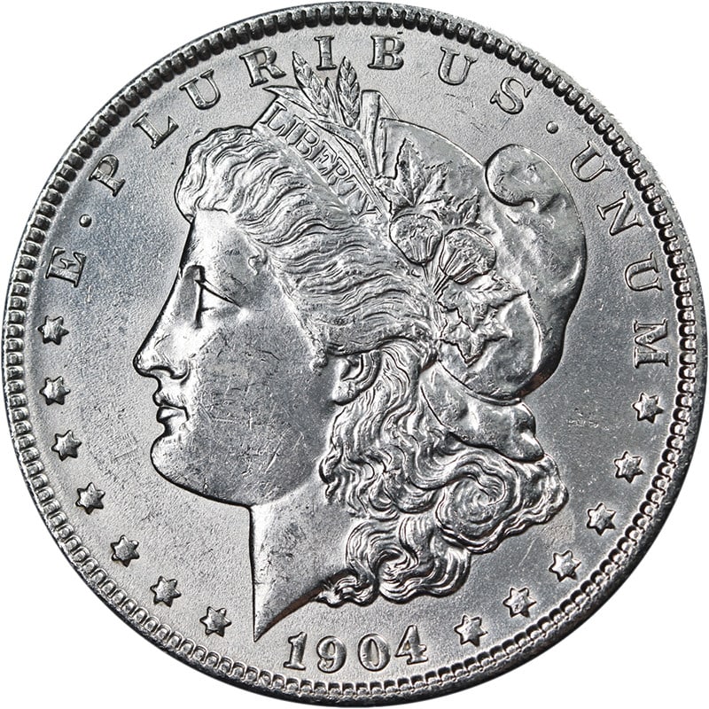 1904 P Morgan Dollar Choice BU Silver: 1904 P Morgan Dollar Choice BU Silver This 1904-P Morgan Silver Dollar is an uncirculated coin featuring excellent luster, a strong strike, and bright white surfaces. It is composed of silver with a f