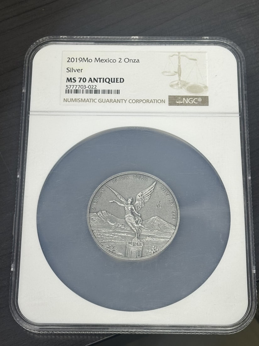 2019 Mexico Silver Libertad 2 oz NGC MS70 Antique Finish: 2019 Mexico Silver Libertad 2 oz NGC MS70 Antique Finish This 2019 Mexican Libertad 2 oz silver coin features an antique finish and is graded MS 70 by NGC. Minted by the Mexican Mint, it is composed o