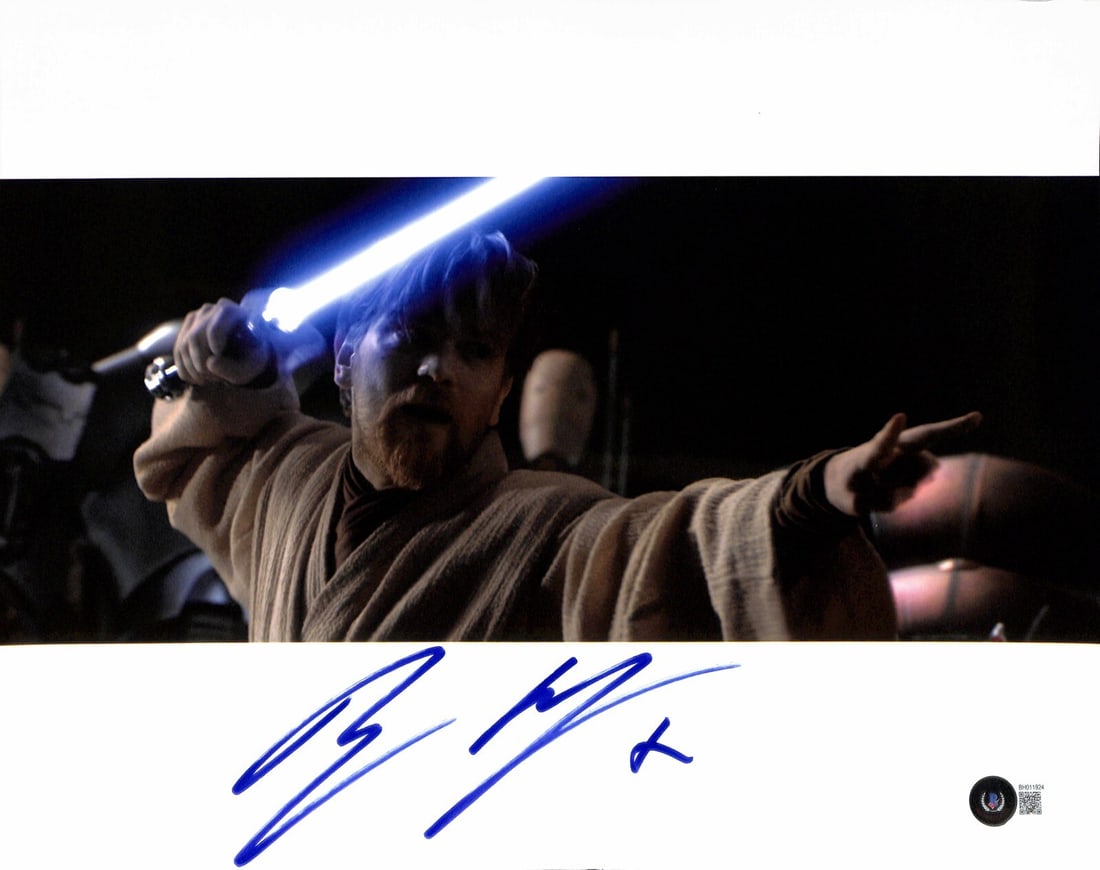 Beckett certified 11x14 signed photo of Ewan McGregor as Obi Wan Kenobi: Beckett certified 11x14 signed photo of Ewan McGregor as Obi Wan Kenobi Original 11x14 photograph from Star Wars: Attack of the Clones, signed by Ewan McGregor as Obi Wan Kenobi in blue permanent mark