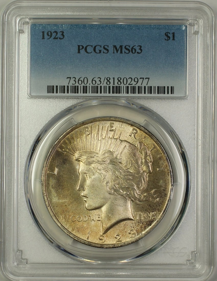 PCGS MS 63 1923 Peace Dollar Silver $1 Toned: PCGS MS 63 1923 Peace Dollar Silver $1 Toned 1923 Peace Silver Dollar $1 coin graded PCGS MS-63 and noted as toned. This uncirculated United States silver coin is a pre-owned example housed in a PCGS 
