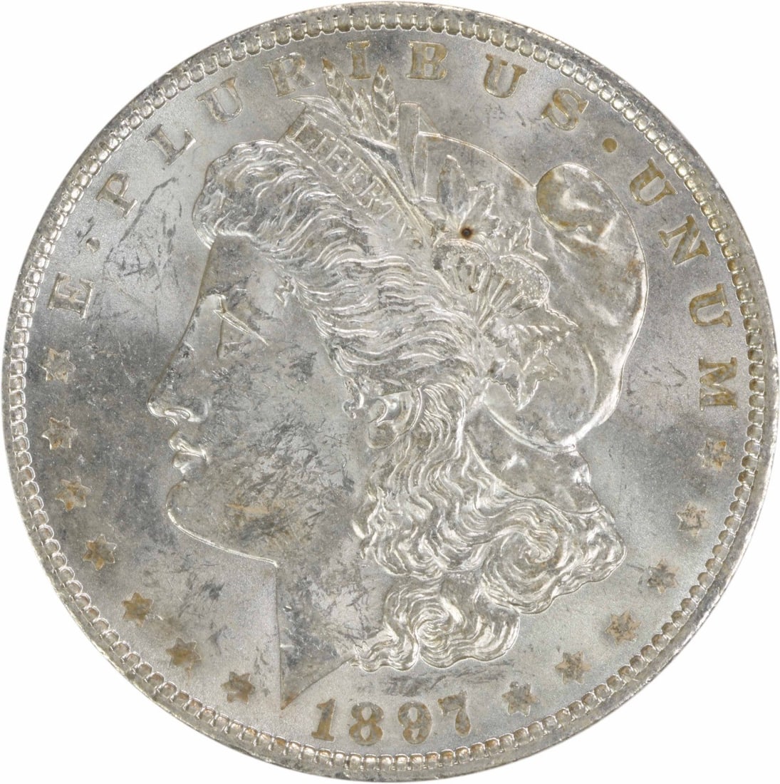 Uncirculated 1897 Silver Dollar Morgan BU Grade Uncertified Coin: Uncirculated 1897 Silver Dollar Morgan BU Grade Uncertified Coin This is an uncirculated 1897 Morgan Silver Dollar featuring a brilliant uncirculated (BU) grade. The coin is composed of silver and was