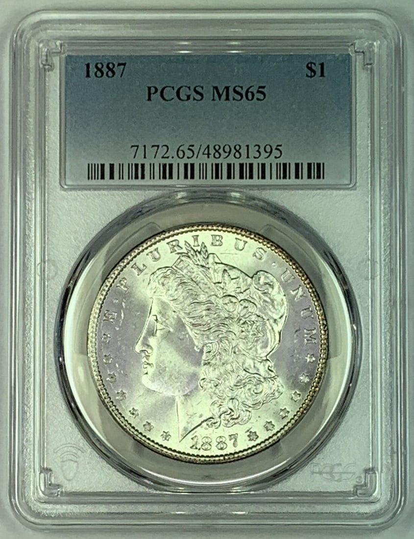 PCGS MS 65 1887 Silver Morgan Dollar Coin Certified: PCGS MS 65 1887 Silver Morgan Dollar Coin Certified This 1887 Morgan Silver Dollar is certified by PCGS with a grade of MS 65. The coin is composed of silver and is uncirculated, originating from the 