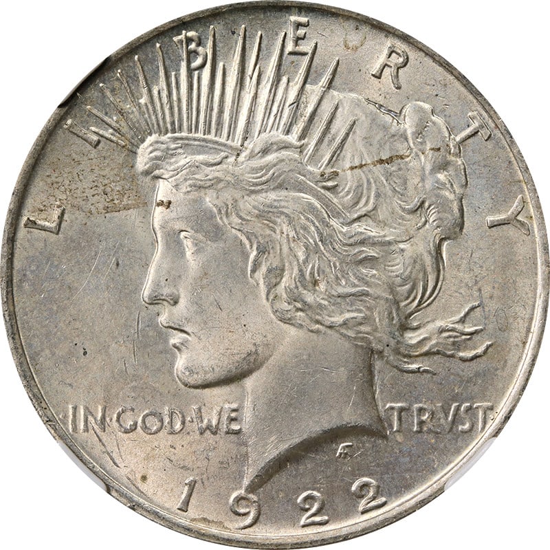 1922 Peace Silver Dollar NGC MS63 with Toned Surfaces: 1922 Peace Silver Dollar NGC MS63 with Toned Surfaces This 1922-P Peace Dollar is graded MS63 by NGC and features natural toning. Struck in silver with a fineness of 0.9, this uncirculated coin origin