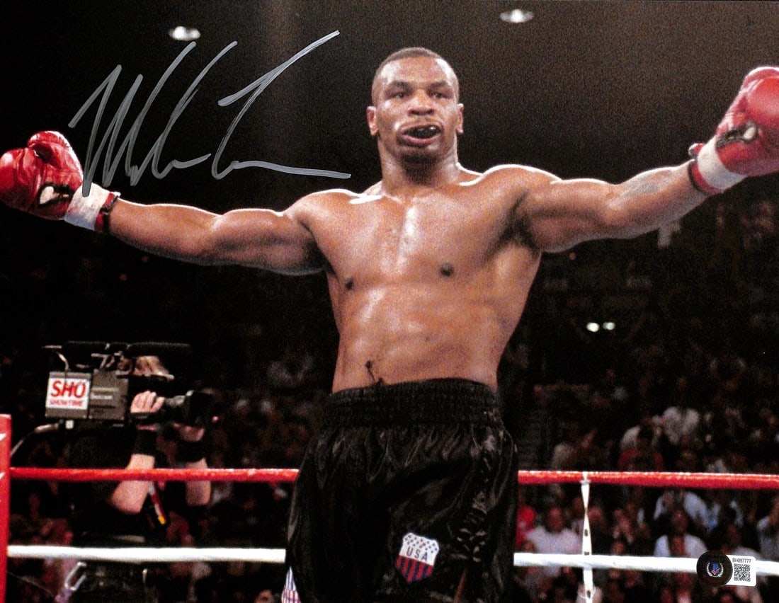 Beckett Certified Mike Tyson Autographed 11x14 Boxing Photo Original: Beckett Certified Mike Tyson Autographed 11x14 Boxing Photo Original Original signed 11x14 photograph autographed by Mike Tyson in silver permanent marker. This pre-owned piece was obtained in person 