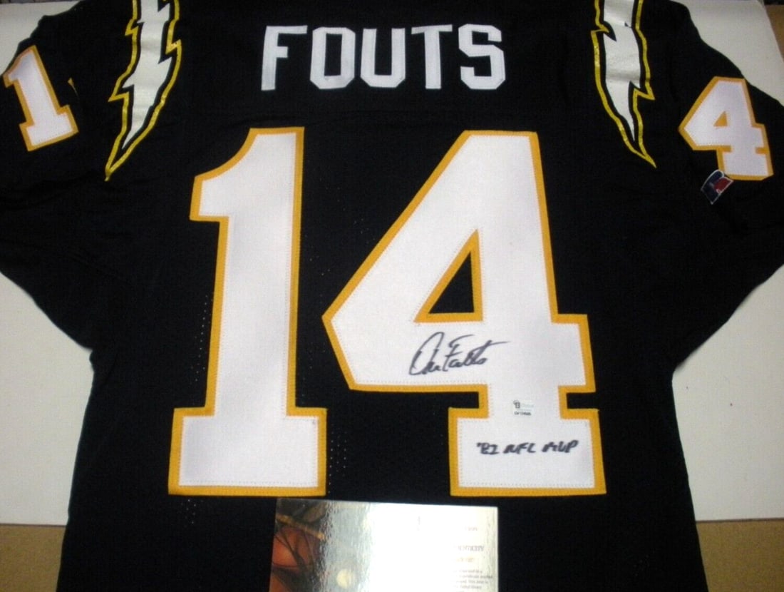 San Diego Chargers Jersey Autographed by Dan Fouts with GAI COA: San Diego Chargers Jersey Autographed by Dan Fouts with GAI COA This is an official licensed Champion brand jersey featuring the San Diego Chargers and signed by Dan Fouts. The collectible autograph m