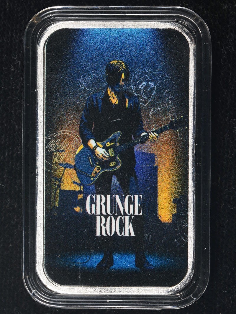 Colorized Grunge Rock Through the Ages 1 oz .999 Silver Art Bar: Colorized Grunge Rock Through the Ages 1 oz .999 Silver Art Bar Original 1 ounce silver art bar from the Rock Through the Ages series featuring the Grunge Rock design with colorized detail. This pre-o
