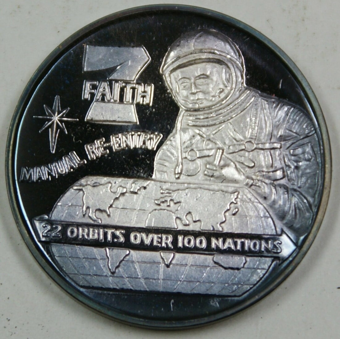 International Mint Faith 7 Silver Commemorative Medal US Space History: International Mint Faith 7 Silver Commemorative Medal US Space History Faith 7 commemorative silver medal honoring the history of America's men in space. Struck by the International Mint, this medal f