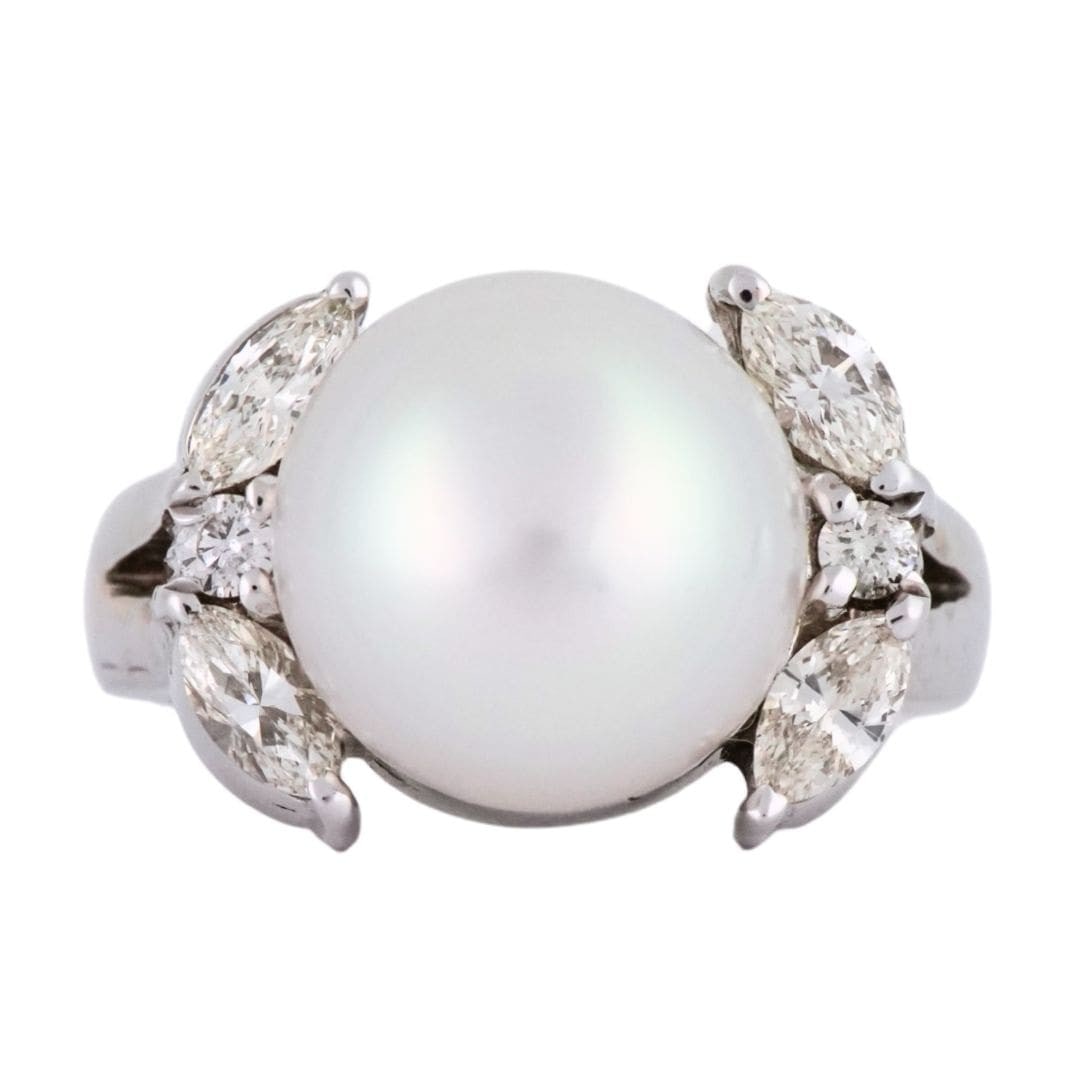 Unbranded Vintage 13k White Gold Ring with Pearl and 0.50 CTW Diamonds: Unbranded Vintage 13k White Gold Ring with Pearl and 0.50 CTW Diamonds Vintage pearl and diamond ring in 13k white gold. The ring features a natural white pearl with very good luster and light pink ov