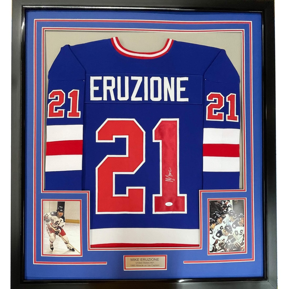 Framed Mike Eruzione signed USA Miracle jersey JSA COA 33x42: Framed Mike Eruzione signed USA Miracle jersey JSA COA 33x42 This professionally framed and matted display features a blue USA "Miracle" jersey autographed by Mike Eruzione. The jersey is authenticate