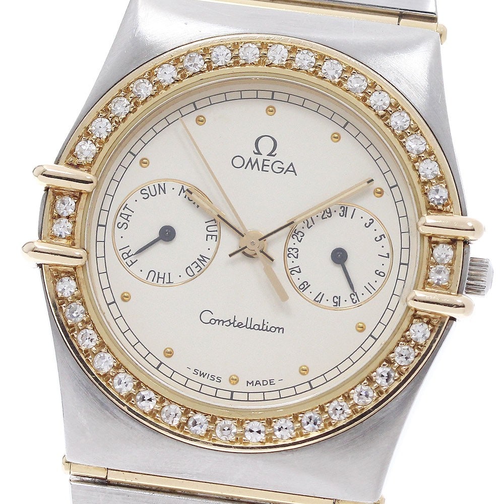 OMEGA Constellation mens quartz wristwatch with diamond bezel day date: OMEGA Constellation mens quartz wristwatch with diamond bezel day date OMEGA Constellation men's wristwatch with a full bar flat diamond bezel and quartz movement. This watch features a beige dial wit