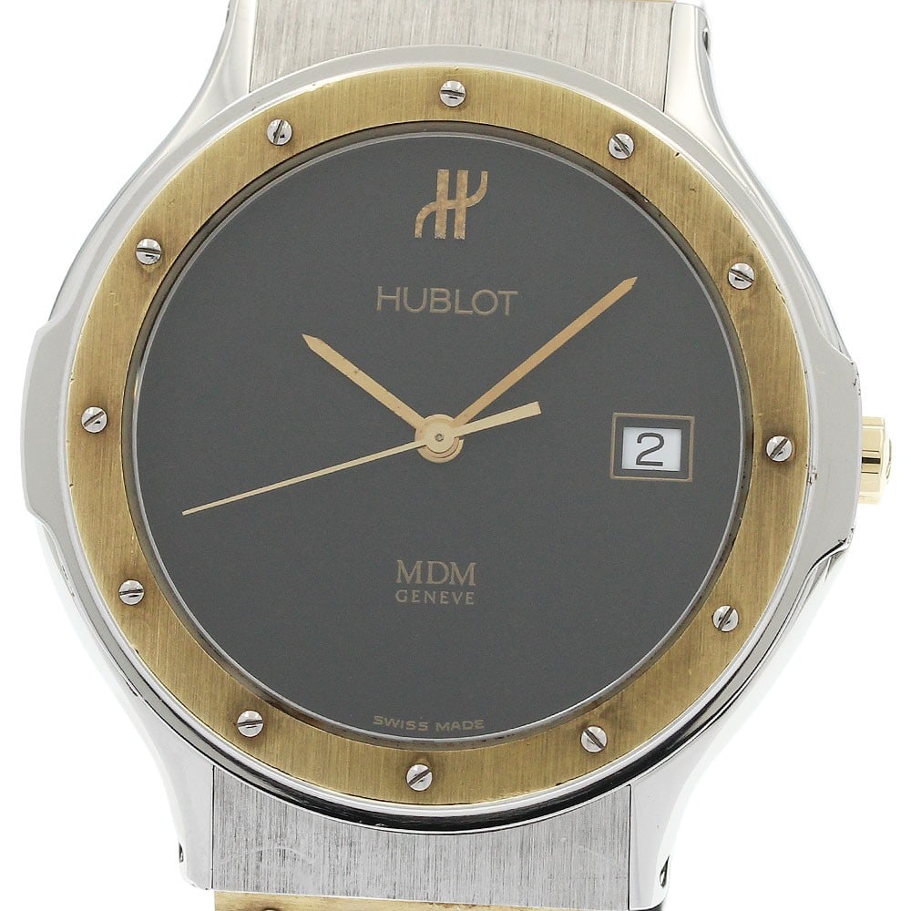 Hublot MDM Classic 1521.2 mens quartz date wristwatch: Hublot MDM Classic 1521.2 mens quartz date wristwatch Hublot MDM Classic Date quartz men's wristwatch with a black dial and date display. The watch features an SS/YG case and a rubber strap. It is off
