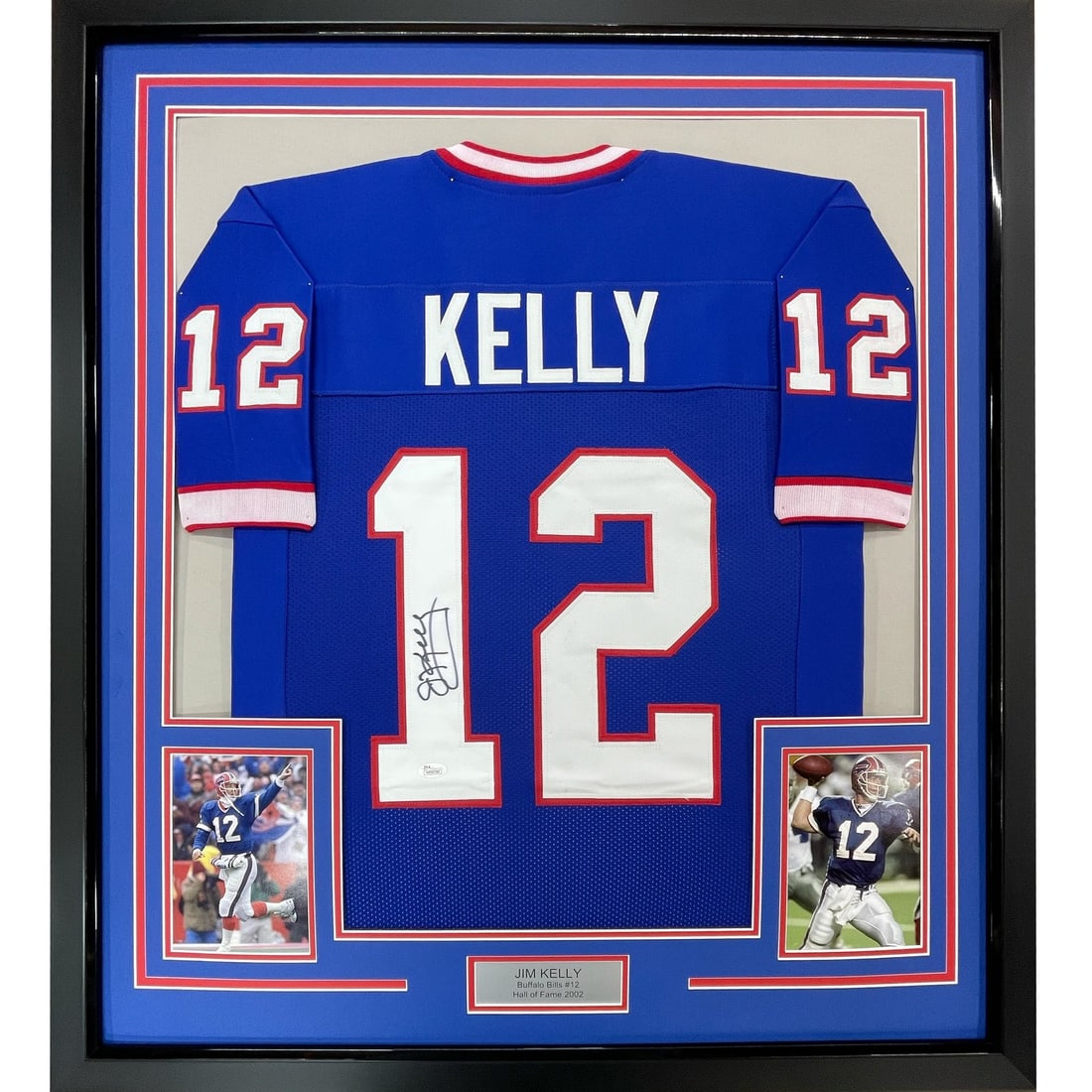 Buffalo Bills Jim Kelly signed framed blue jersey JSA 35x39: Buffalo Bills Jim Kelly signed framed blue jersey JSA 35x39 Professionally framed and matted original Jim Kelly signed Buffalo Bills blue jersey display. This pre-owned piece includes two 5x7 photos a