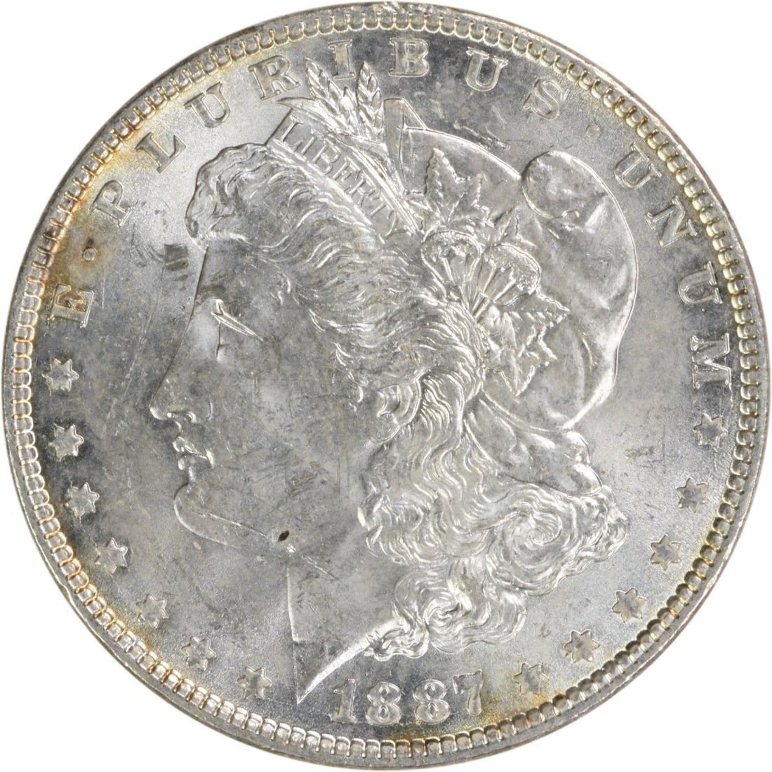 1887 Morgan Dollar Silver Coin Brilliant Uncirculated Uncertified: 1887 Morgan Dollar Silver Coin Brilliant Uncirculated Uncertified This is an uncirculated 1887 Morgan Silver Dollar featuring a brilliant uncirculated (BU) grade. The coin was minted in the United Sta