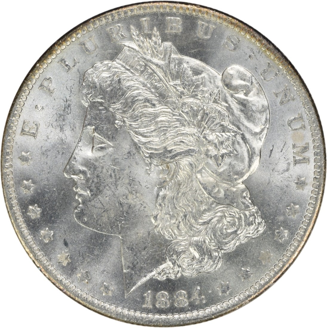 Uncirculated 1884 O Silver Dollar Morgan Type Brilliant Uncertified: Uncirculated 1884 O Silver Dollar Morgan Type Brilliant Uncertified This 1884-O Morgan Silver Dollar is a brilliant uncirculated coin from the New Orleans Mint. Composed of silver, it features the cla