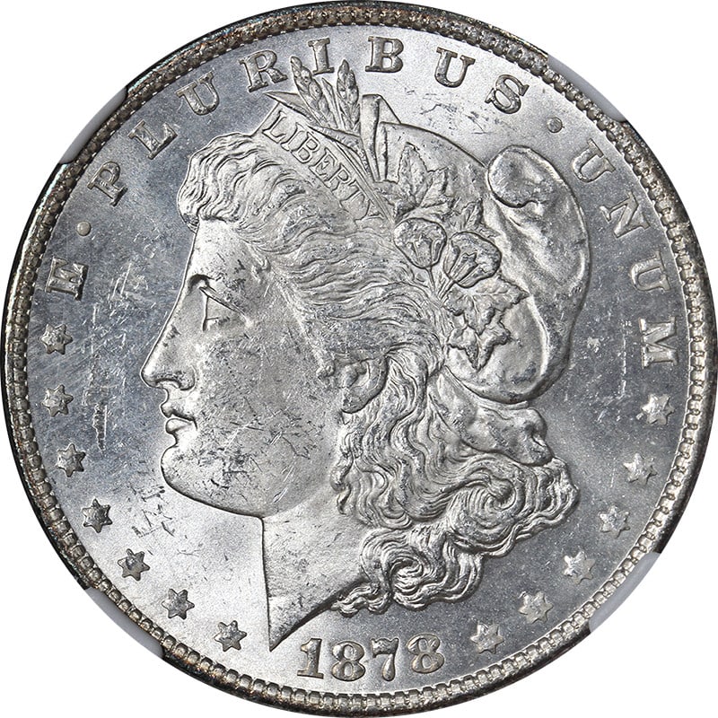 NGC MS62 1878-P Morgan Silver Dollar 7TF Rev 79: NGC MS62 1878-P Morgan Silver Dollar 7TF Rev 79 Original 1878-P 7TF Rev 79 Morgan Silver Dollar with blast white surfaces, fantastic luster, and a nice strike. This certified uncirculated coin is grad