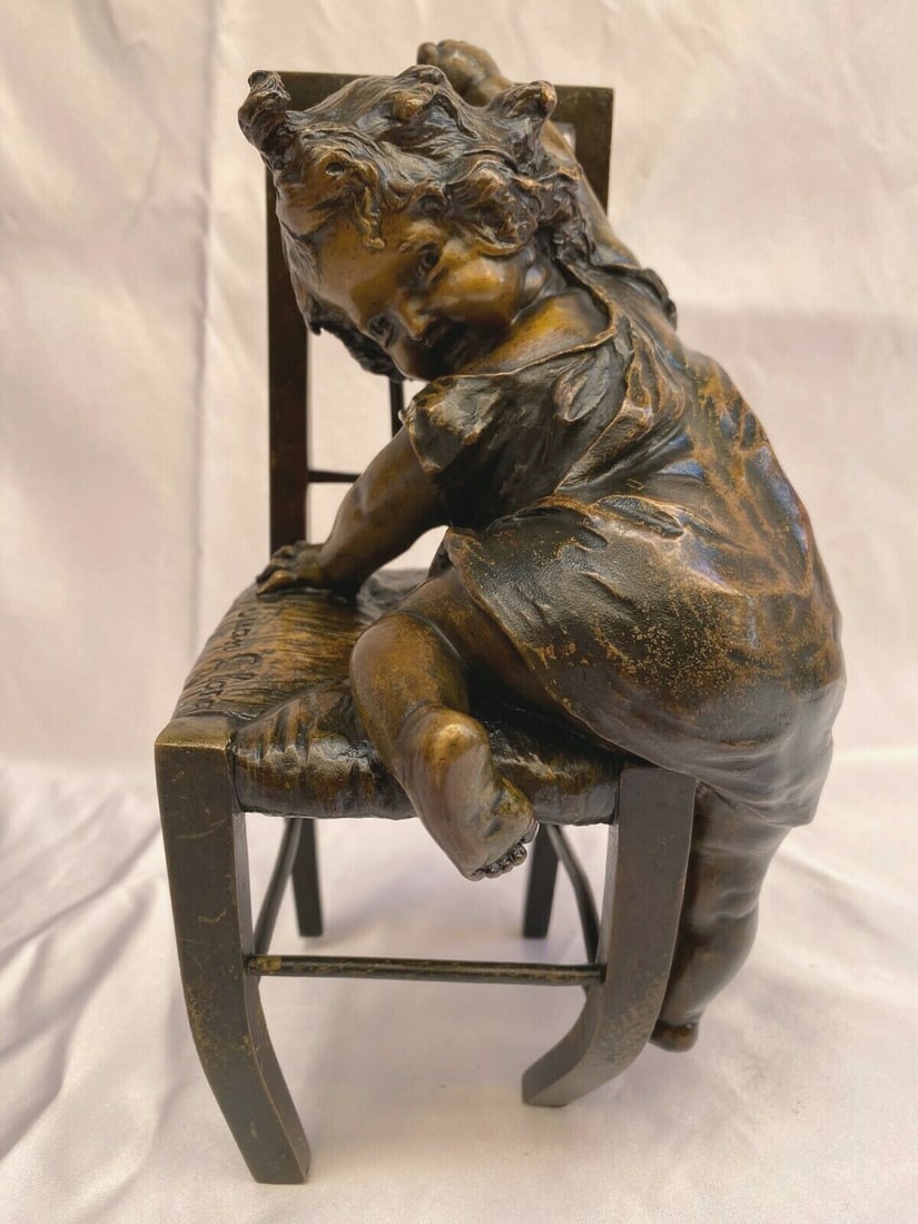 Juan Clara signed bronze sculpture seated girl on chair 1900: Juan Clara signed bronze sculpture seated girl on chair 1900 Bronze sculpture depicting a girl seated on a chair, attributed in the listing to Spanish artist Juan Clara. Purchased in Paris approximate