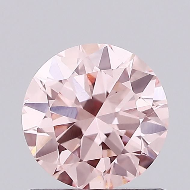 Loose Diamond - ROUND 0.74ct Fancy Vivid Pink VVS2: Loose Diamond - ROUND 0.74ct Fancy Vivid Pink VVS2 Source: This is a real non-mined Diamond that has been grown in a lab Shape: ROUND Carats: 0.74 Color: Fancy Vivid Pink Certification: IGI Additional