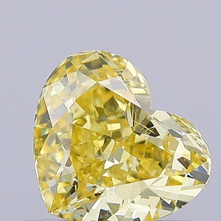 Loose Diamond - HEART 0.71ct Fancy Intense Yellow VS2: Loose Diamond - HEART 0.71ct Fancy Intense Yellow VS2 Source: This is a real non-mined Diamond that has been grown in a lab Shape: HEART Carats: 0.71 Color: Fancy Intense Yellow Certification: IGI Vid