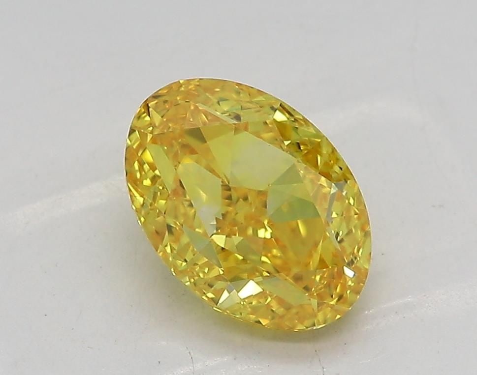 Loose Diamond - OVAL 1.55ct Fancy Vivid Yellow VS1: Loose Diamond - OVAL 1.55ct Fancy Vivid Yellow VS1 Source: This is a real non-mined Diamond that has been grown in a lab Shape: OVAL Carats: 1.55 Color: Fancy Vivid Yellow Certification: IGI Video: