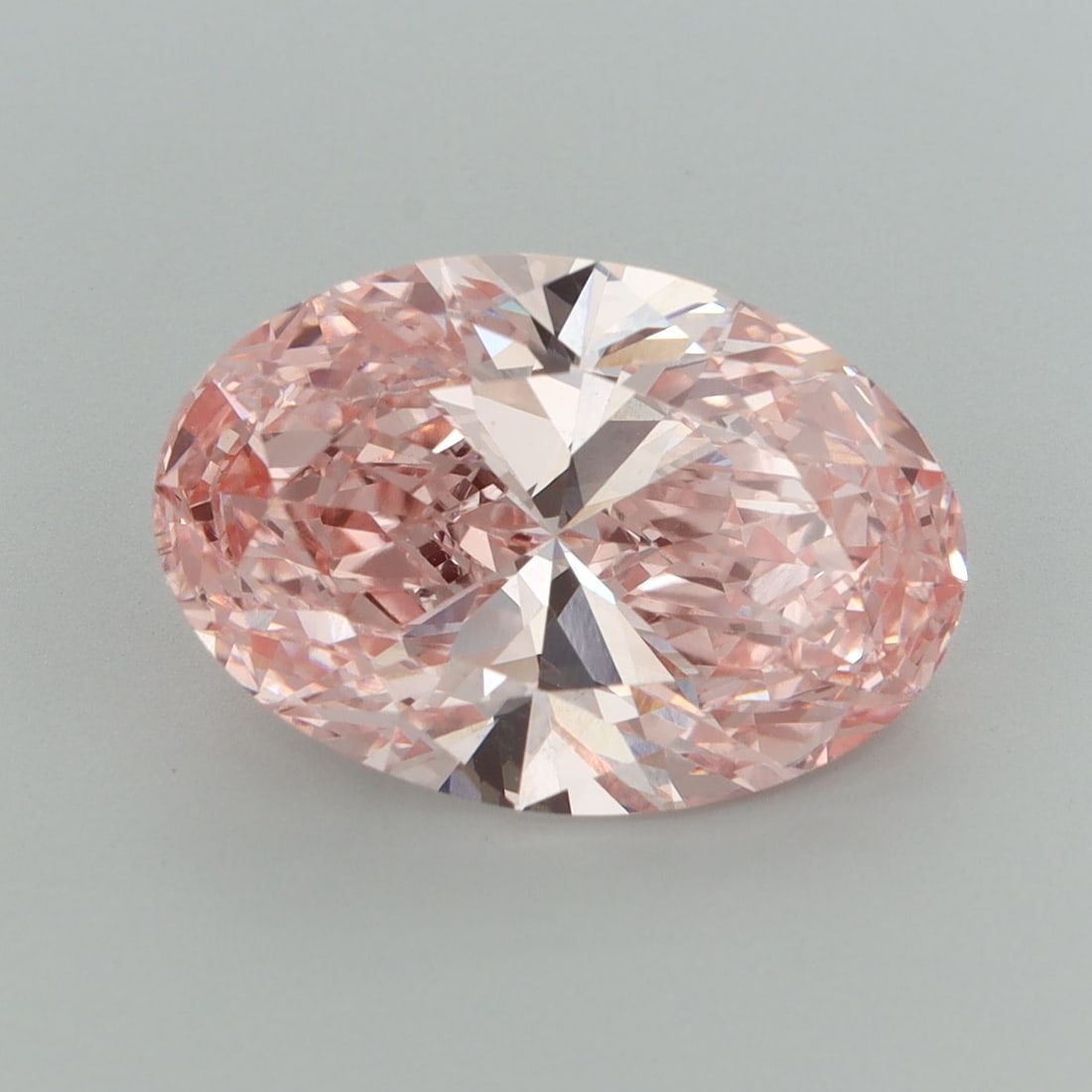 Loose Diamond - OVAL 5.57ct Fancy Vivid Pink VS1: Loose Diamond - OVAL 5.57ct Fancy Vivid Pink VS1 Source: This is a real non-mined Diamond that has been grown in a lab Shape: OVAL Carats: 5.57 Color: Fancy Vivid Pink Certification: IGI Video:
