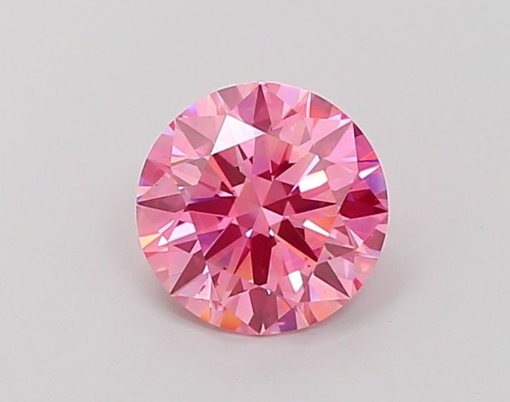 Loose Diamond - ROUND 1.11ct Fancy Vivid Pink VS2: Loose Diamond - ROUND 1.11ct Fancy Vivid Pink VS2 Source: This is a real non-mined Diamond that has been grown in a lab Shape: ROUND Carats: 1.11 Color: Fancy Vivid Pink Certification: IGI Video: