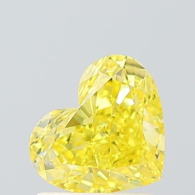 Loose Diamond - HEART 1.31ct Fancy Vivid Yellow VS2: Loose Diamond - HEART 1.31ct Fancy Vivid Yellow VS2 Source: This is a real non-mined Diamond that has been grown in a lab Shape: HEART Carats: 1.31 Color: Fancy Vivid Yellow Certification: IGI Video: