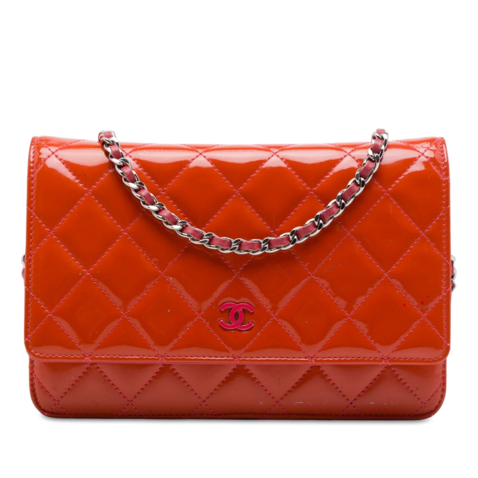 Chanel Incognito Wallet On Chain in Orange Quilted Patent Leather: Chanel Incognito Wallet On Chain in Orange Quilted Patent Leather A Chanel wallet on chain in orange quilted patent leather. This piece features a leather-woven chain strap, a flap with snap closure, 