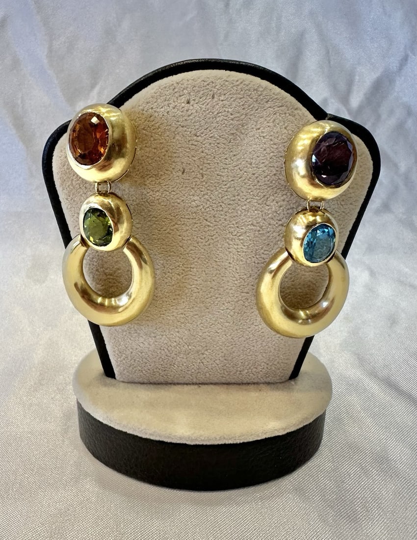 French 18K Yellow Gold Pierced Clip Earrings with Amethyst Peridot Citrine Topaz: French 18K Yellow Gold Pierced Clip Earrings with Amethyst Peridot Citrine Topaz Magnificent pair of French earrings crafted in 18k yellow gold and set with peridot, citrine, amethyst, and blue topaz.