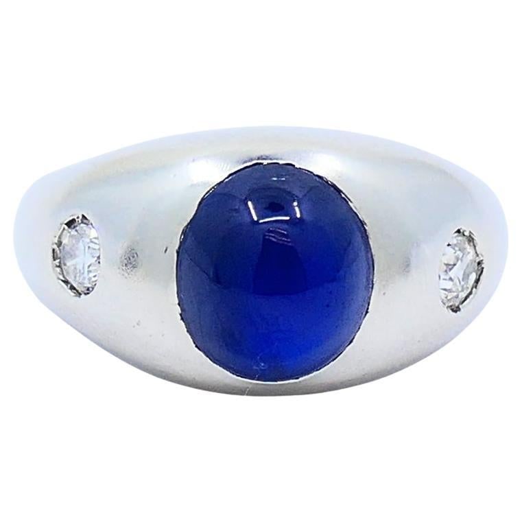 Mid-20th Century 14k White Gold Sapphire Diamond Ring Size 9: Mid-20th Century 14k White Gold Sapphire Diamond Ring Size 9 14k white gold ring featuring a cabochon sapphire centerpiece with two diamonds set on either side. The ring is described as Art Deco style
