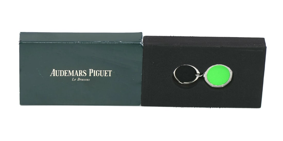 Royal Oak Green Stainless Steel Key Chain Accessory for Men: Royal Oak Green Stainless Steel Key Chain Accessory for Men This Audemars Piguet Royal Oak key chain ring features a green color and is crafted from stainless steel. Designed for men, it is a stylish 