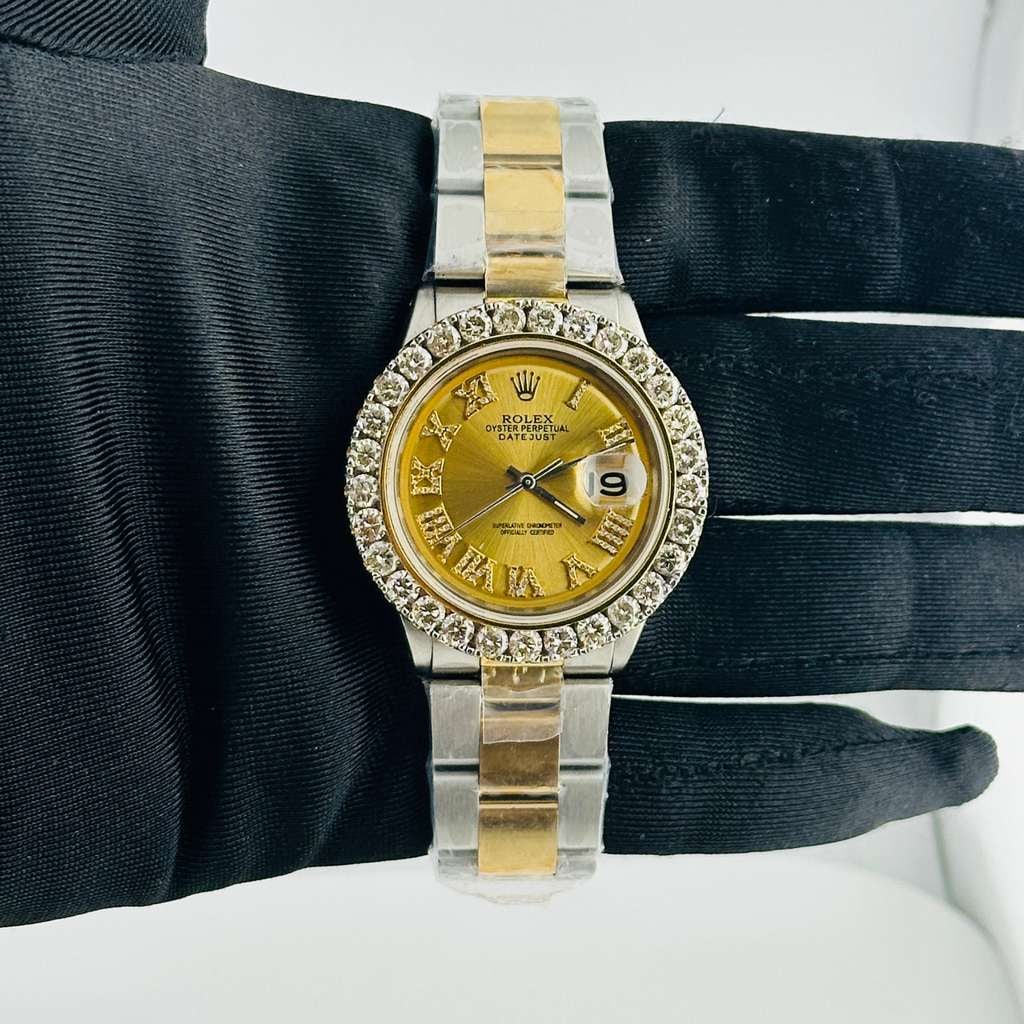 Rolex Datejust Ref 1601 Mens Watch Diamond Bezel Aftermarket Oyster Dial: Rolex Datejust Ref 1601 Mens Watch Diamond Bezel Aftermarket Oyster Dial This Rolex Datejust features an aftermarket champagne Roman dial and an aftermarket Oyster bracelet. The watch is equipped with