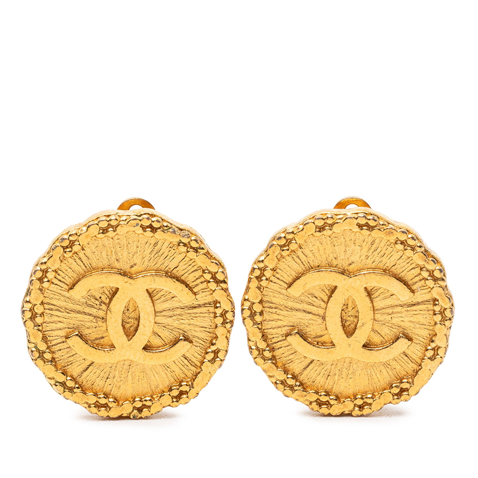 Chanel CC Round Sunburst Clip On Earrings Gold Tone Metal: Chanel CC Round Sunburst Clip On Earrings Gold Tone Metal Round clip-on earrings with a sunburst design and CC motif. They feature a gold tone metal body and clip-on closures. Condition is B+ with vis