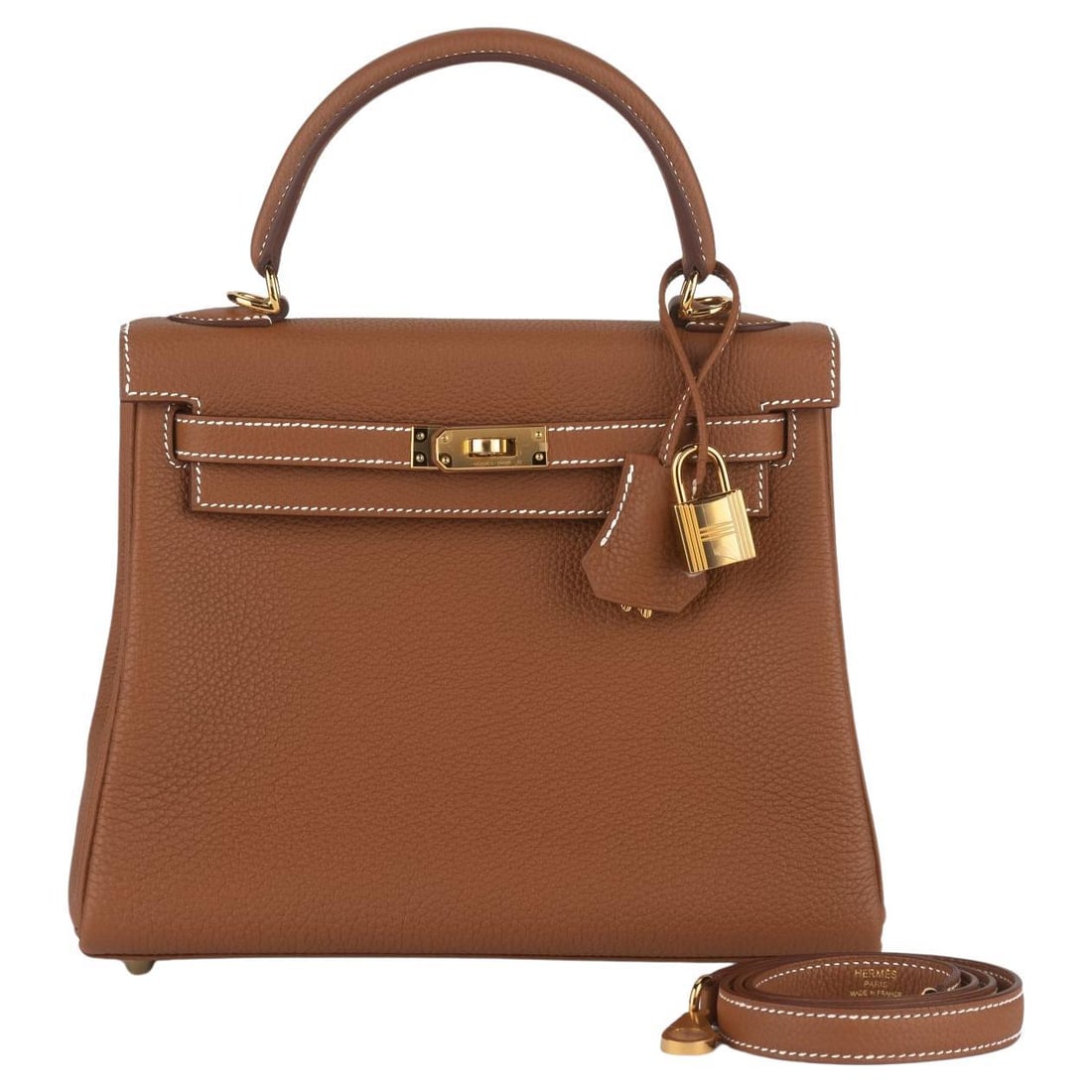 Hermes Kelly 25 Retourne Togo Bag Gold with Strap: Hermes Kelly 25 Retourne Togo Bag Gold with Strap Hermes Kelly 25 Retourne in gold Togo leather with white stitching and gold tone hardware. Includes a matching detachable shoulder strap, clochette, t