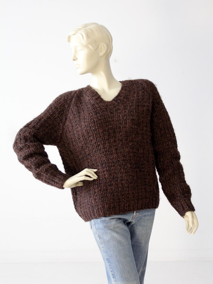 Handmade Vintage Chunky Knit Sweater Dark Brown V-Neck: Handmade Vintage Chunky Knit Sweater Dark Brown V-Neck This vintage chunky knit sweater offers an ultra-soft feel and a timeless design. Hand-made, this dark brown pullover features a stylish v-neckli