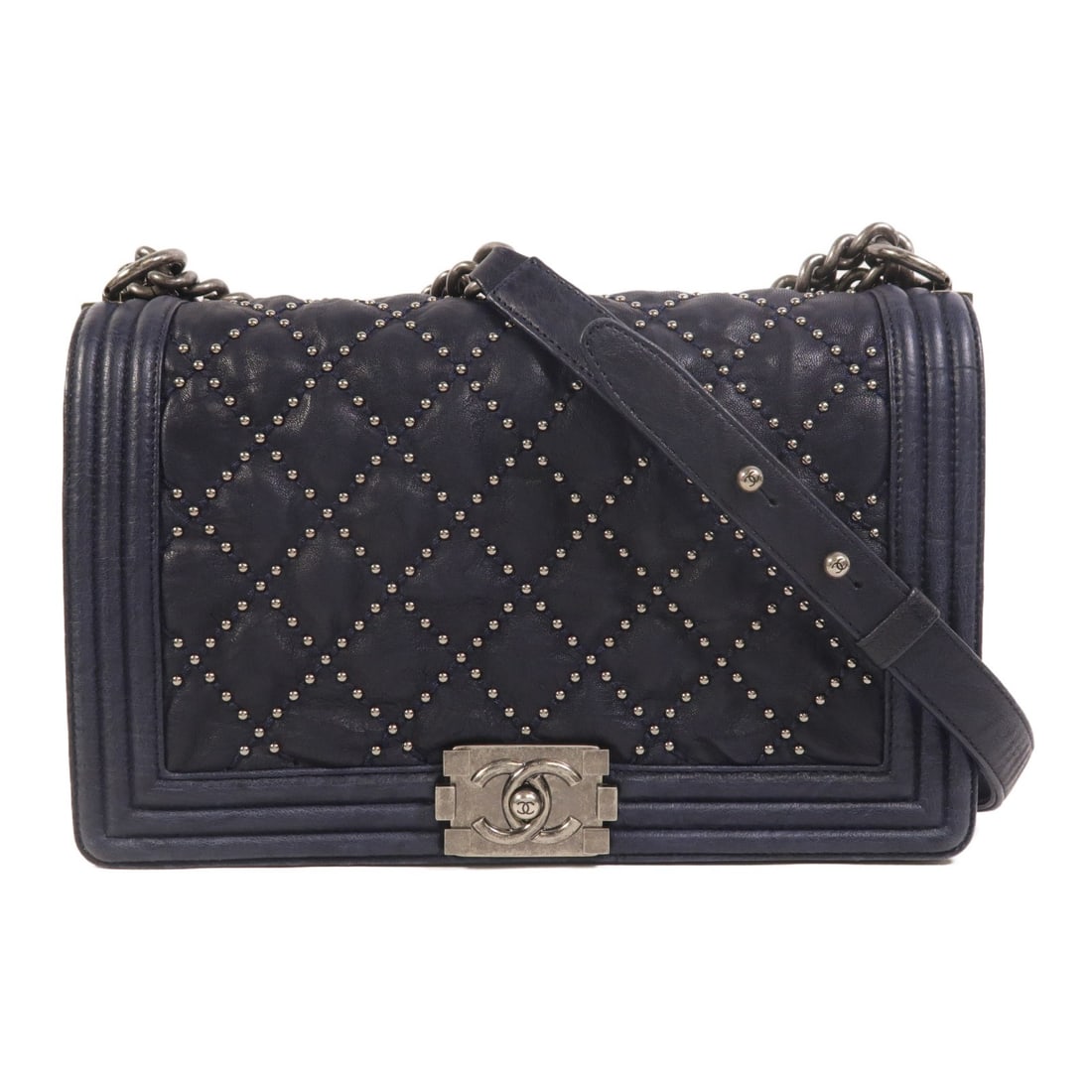 CHANEL Boy 28 Navy Calfskin Shoulder Bag CC: CHANEL Boy 28 Navy Calfskin Shoulder Bag CC CHANEL CC Boy 28 shoulder bag in navy calfskin leather with a shoulder strap and an interior featuring one open pocket and one zip pocket. Includes storage 