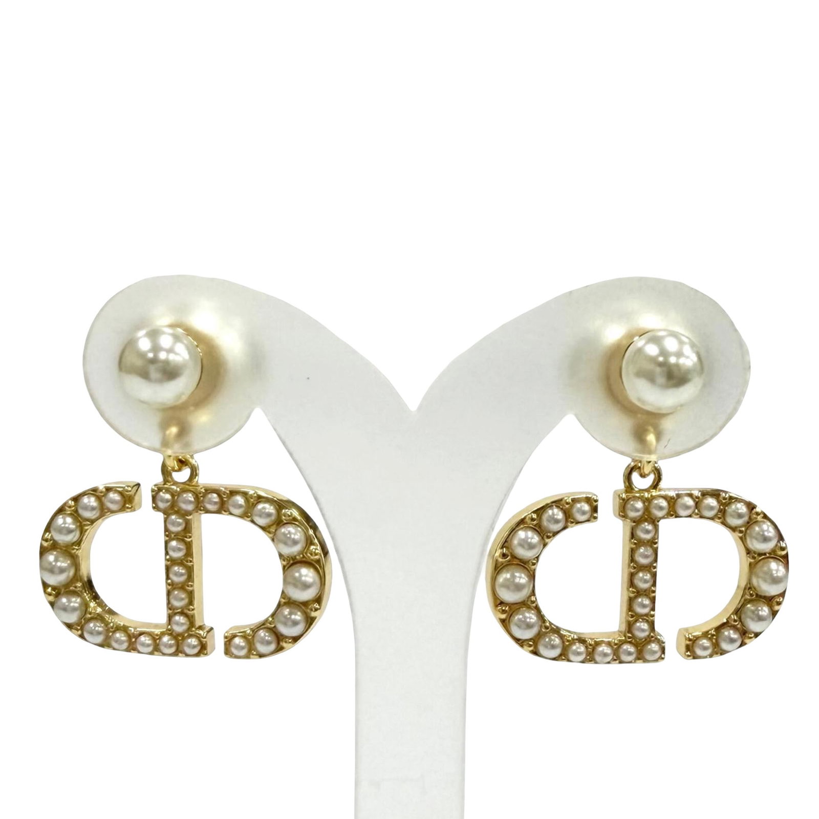 Dior Tribales Faux Pearl Gold Tone Earrings Push Back: Dior Tribales Faux Pearl Gold Tone Earrings Push Back Dior Tribales push back earrings in gold-tone metal with CD logo detailing and faux pearl embellishments. This costume jewelry pair is made in Ita
