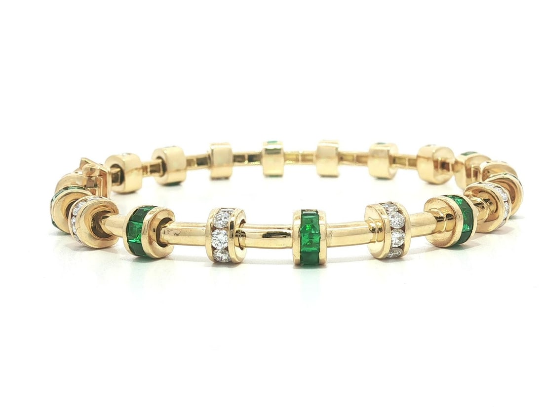 Charles Krypell 18k Gold Tube Bracelet with Emerald and Diamond Stations: Charles Krypell 18k Gold Tube Bracelet with Emerald and Diamond Stations Charles Krypell signature station tube bracelet crafted in solid 18k yellow gold with natural emerald and diamond stations. Thi