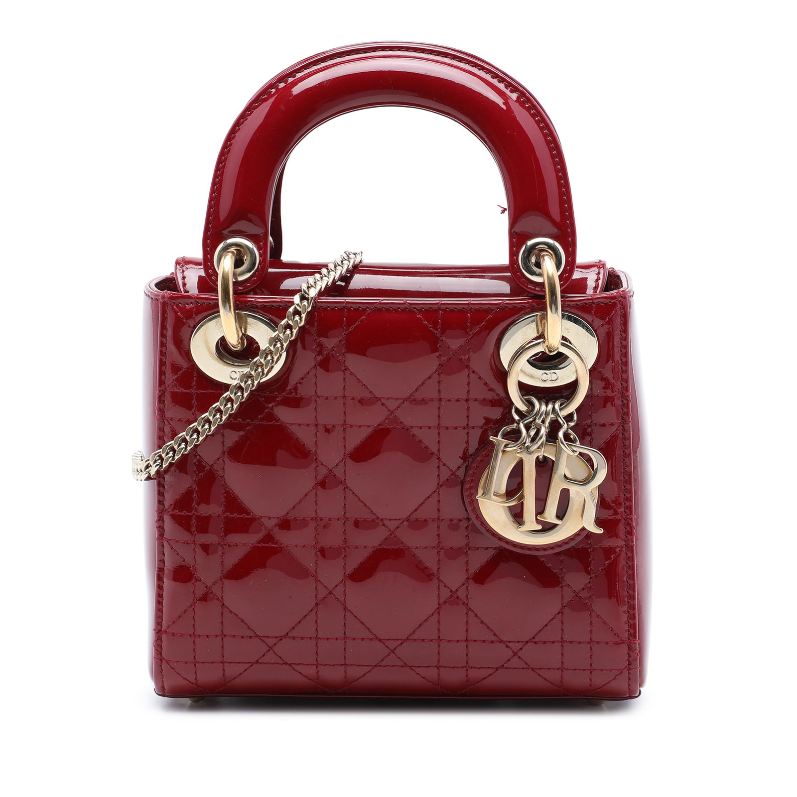 Dior Lady Dior Mini Cannage Patent Leather Bag Red: Dior Lady Dior Mini Cannage Patent Leather Bag Red A compact Lady Dior handbag crafted in red patent leather with the signature Cannage quilted design. This mini bag features flat top handles, a detac