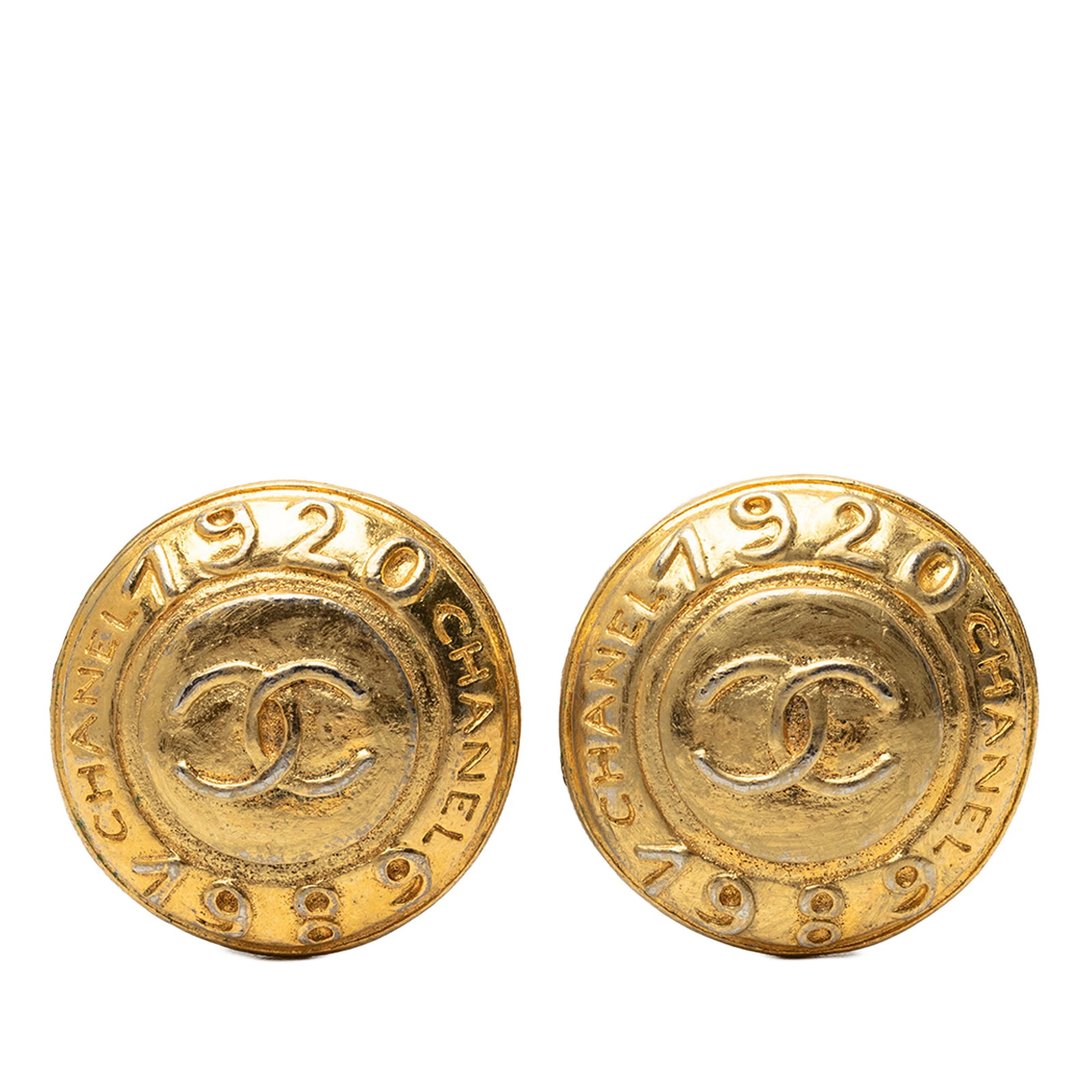 Round Clip On Earrings Chanel CC Gold Plated Logo: Round Clip On Earrings Chanel CC Gold Plated Logo Round clip-on earrings with the Chanel CC logo in gold plated metal. Made in France, this costume jewelry pair has a classic logo design with clip-on 