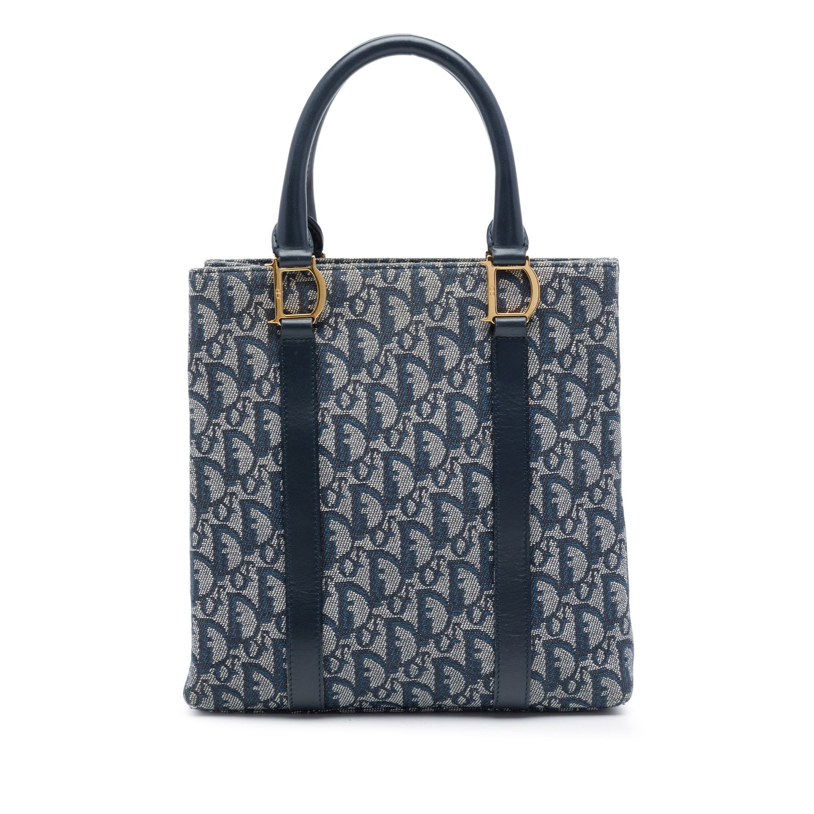 Dior Diorissimo Trotter Blue Canvas Tote Bag: Dior Diorissimo Trotter Blue Canvas Tote Bag Dior Diorissimo Trotter canvas tote with leather trim and rolled leather handles. The bag features an open top with a magnetic snap closure, along with int