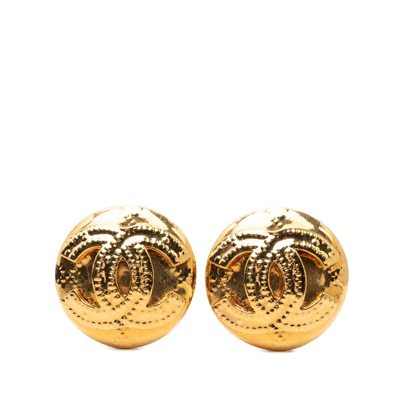 Chanel Round CC Clip Earrings Gold Plated Metal: Chanel Round CC Clip Earrings Gold Plated Metal Round clip-on earrings with the Chanel CC motif in gold plated metal. Made in France, this costume jewelry pair has a classic circular design and clip-o