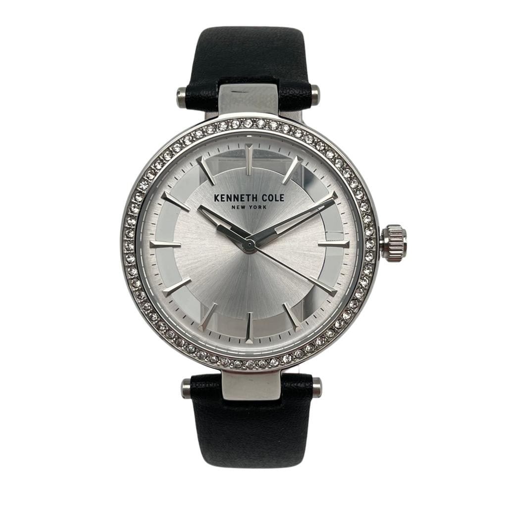 Kenneth Cole New York womens quartz watch 34mm silver skeleton dial: Kenneth Cole New York womens quartz watch 34mm silver skeleton dial Pre-owned Kenneth Cole ladies wristwatch with a classic design, featuring a silver skeleton dial and quartz movement. The round stai