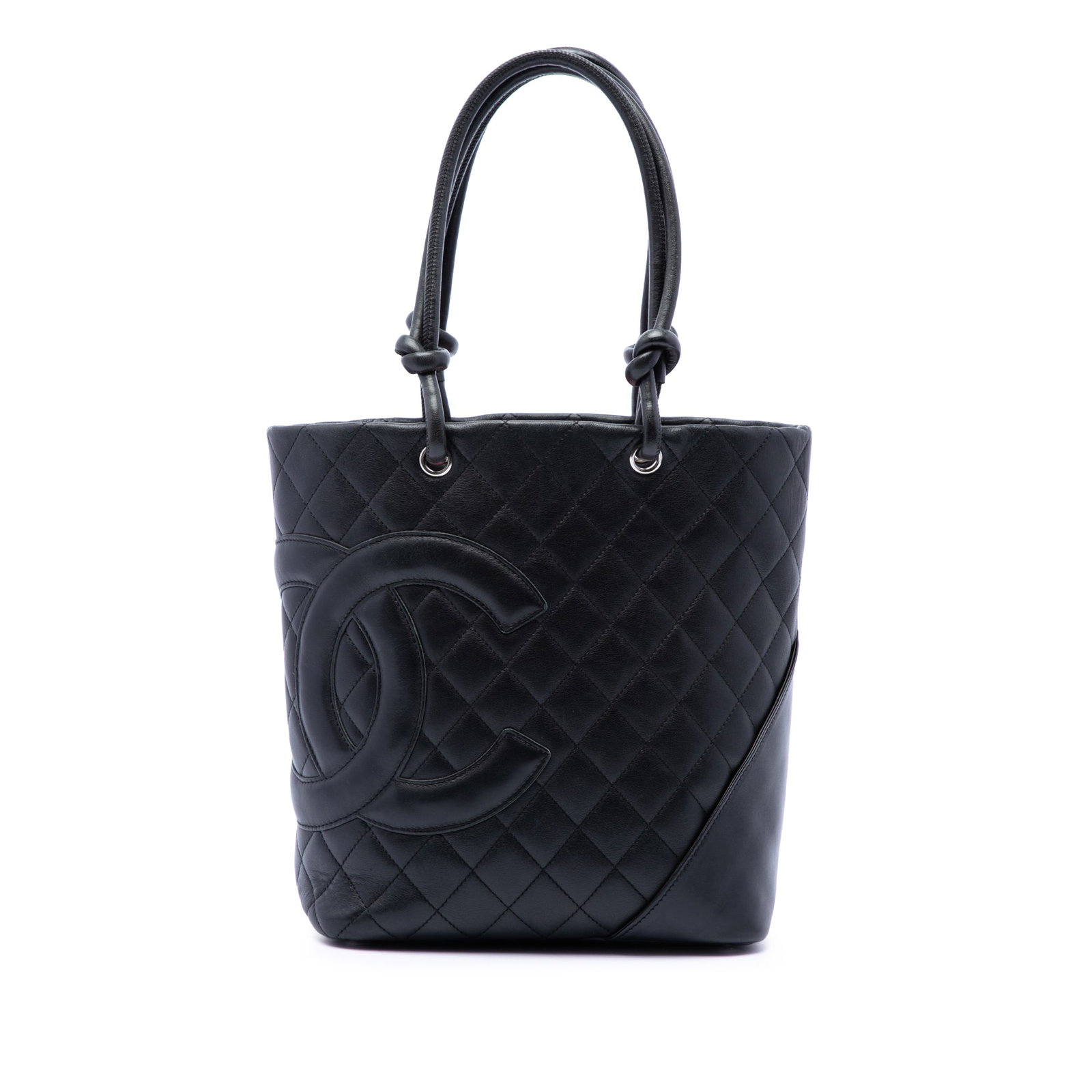 Chanel Cambon Ligne Medium Tote in Black Lambskin Leather: Chanel Cambon Ligne Medium Tote in Black Lambskin Leather A Chanel Cambon Ligne medium tote crafted in quilted lambskin leather. This tote features rolled leather handles, a top zip closure, an exteri
