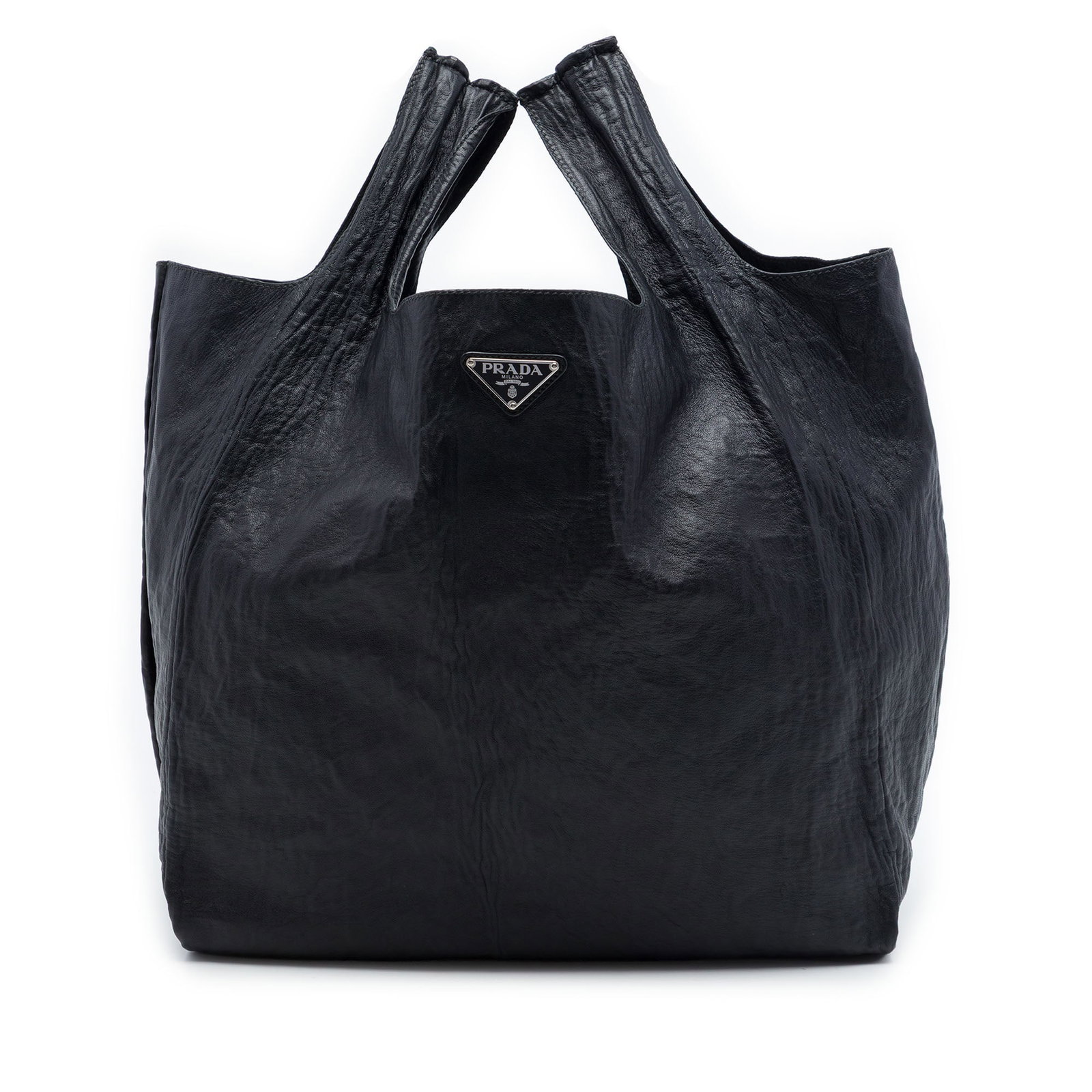 Prada Crinkled Nappa Leather Tote Bag Black: Prada Crinkled Nappa Leather Tote Bag Black Prada Crinkled Nappa Tote in black leather with flat leather handles and an open top. Made in Italy. Condition is B+ with noted wear including creasing to t