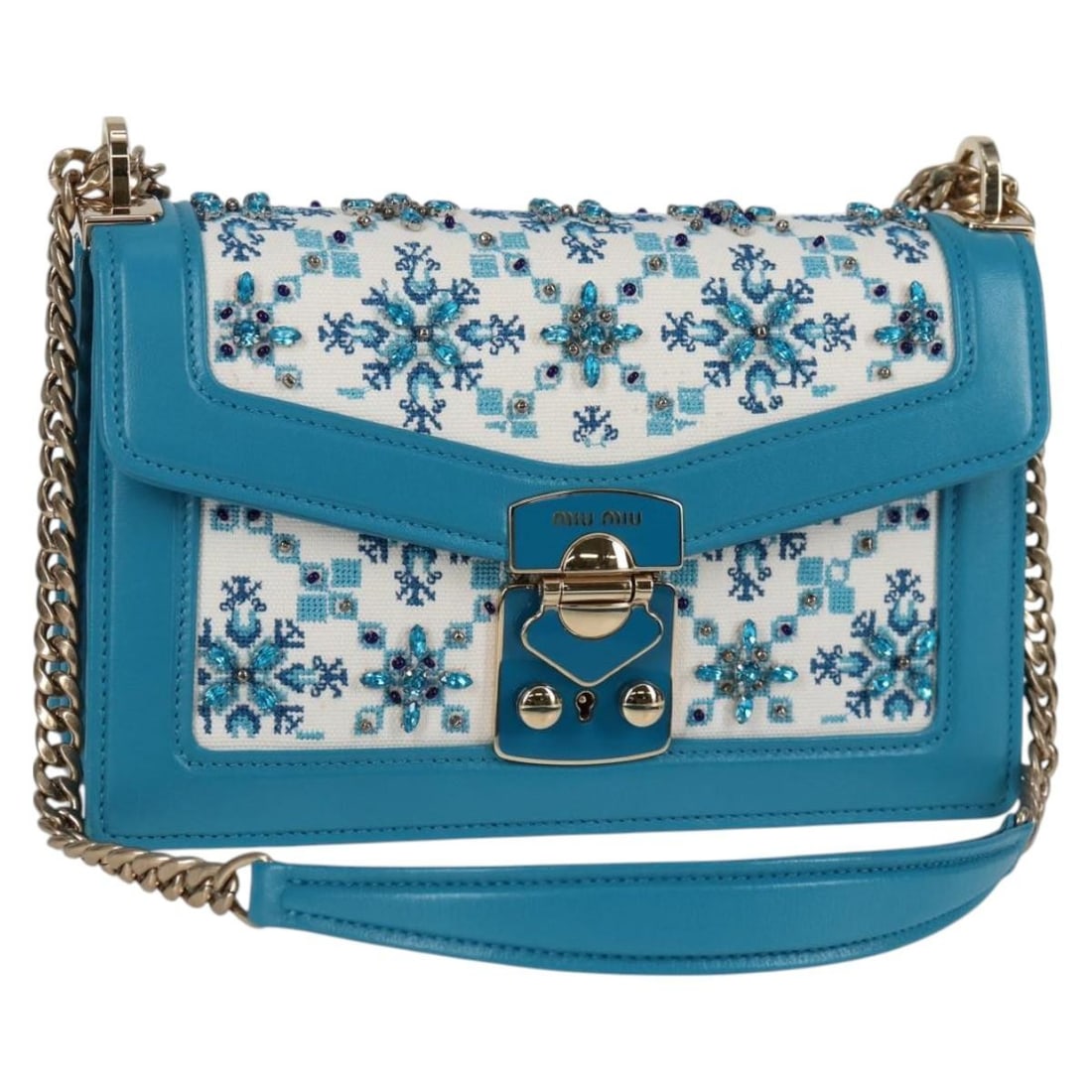 Miu Miu 5BD083 blue canvas shoulder bag with chain strap: Miu Miu 5BD083 blue canvas shoulder bag with chain strap Miu Miu shoulder bag in blue canvas with gold-tone accents. This women's bag features a chain shoulder strap with an adjustable drop and comes 