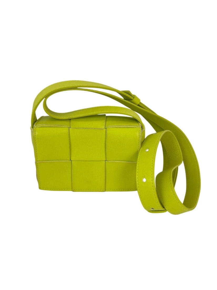 Bottega Veneta Mini Pouch crossbody bag green lambskin Intrecciato: Bottega Veneta Mini Pouch crossbody bag green lambskin Intrecciato This Bottega Veneta Intrecciato Mini Cassette is a stylish crossbody bag crafted from luxurious lime green lambskin leather. Designed