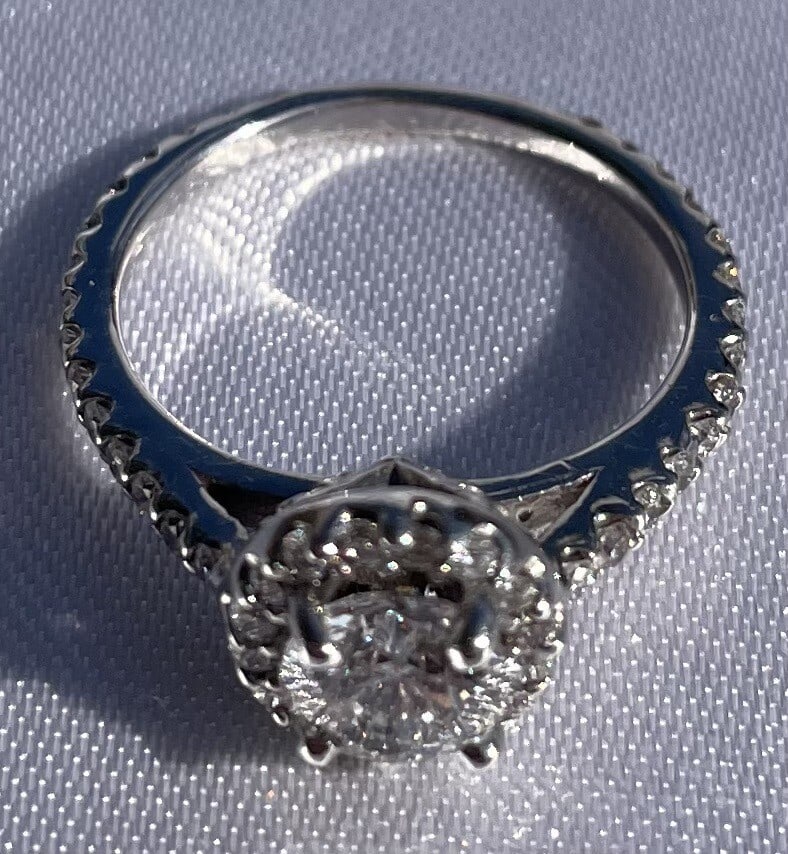 Retro diamond ring in 14K white gold size 4.5: Retro diamond ring in 14K white gold size 4.5 European retro diamond ring crafted in tested 14k white gold. This pre-owned ring features round brilliant and full cut diamonds with detailed retro desig