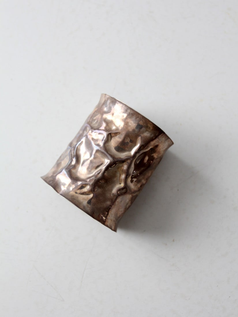 1970s Vintage Reticulated Metal Cuff Silver Tone Bold Design: 1970s Vintage Reticulated Metal Cuff Silver Tone Bold Design This stunning vintage cuff from the 1970s showcases a bold and eye-catching design. Crafted from reticulated metal, the large bracelet feat
