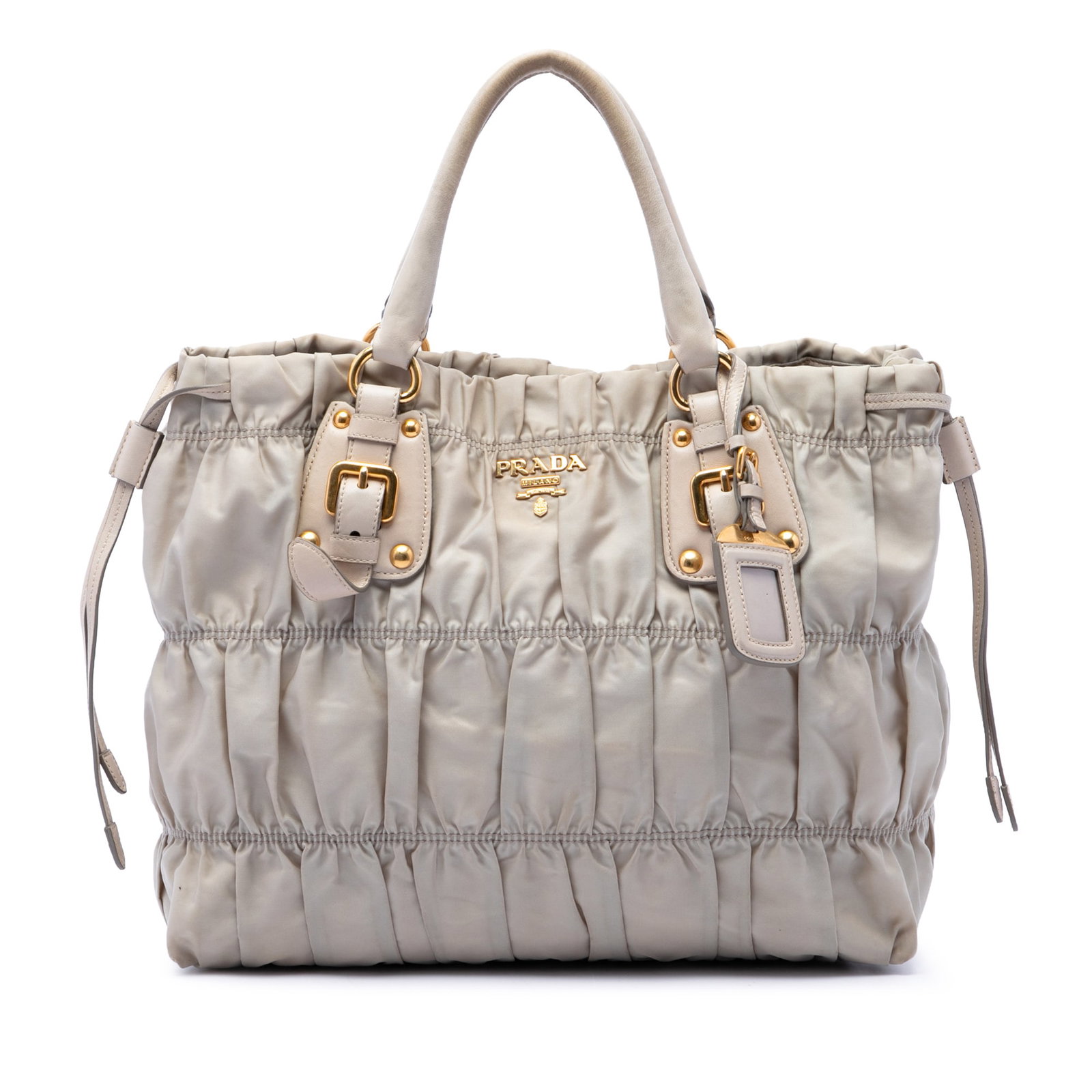 Prada Tessuto Gaufre Brown Nylon Satchel Bag: Prada Tessuto Gaufre Brown Nylon Satchel Bag A Prada Tessuto Gaufre satchel crafted with a gathered nylon body and rolled leather handles. The bag features an open top with a magnetic snap closure, al