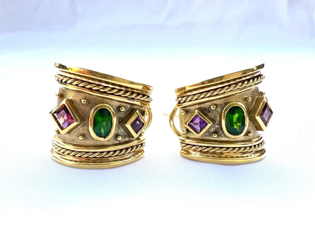 SeidenGang 18K Yellow Gold Pierced Earrings Multi Stone Greek Pair: SeidenGang 18K Yellow Gold Pierced Earrings Multi Stone Greek Pair Pair of SeidenGang pierced earrings crafted in 18k yellow gold and set with green tourmaline, amethyst, and rhodolite garnet. Made in